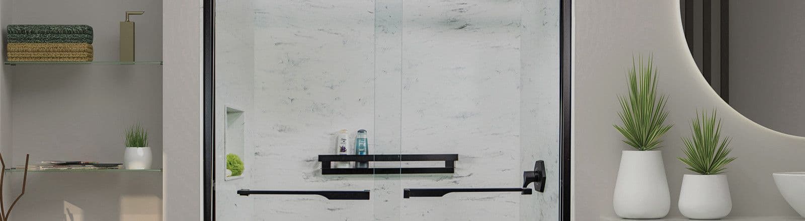 A walk-in shower with sliding glass doors, black fixtures, gray marbled walls, and side shelf.